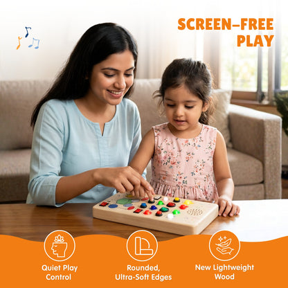 A mother and her daughter playing with the Beat Maker board together at a table