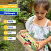 Toddler playing with the Montessori Jungle Piano busy board, engaging with musical and sensory activities.