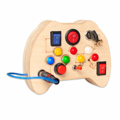 Close Up of Tinker Pad Montessori Busy Board V2 wooden activity board with switches, plug, key, and more
