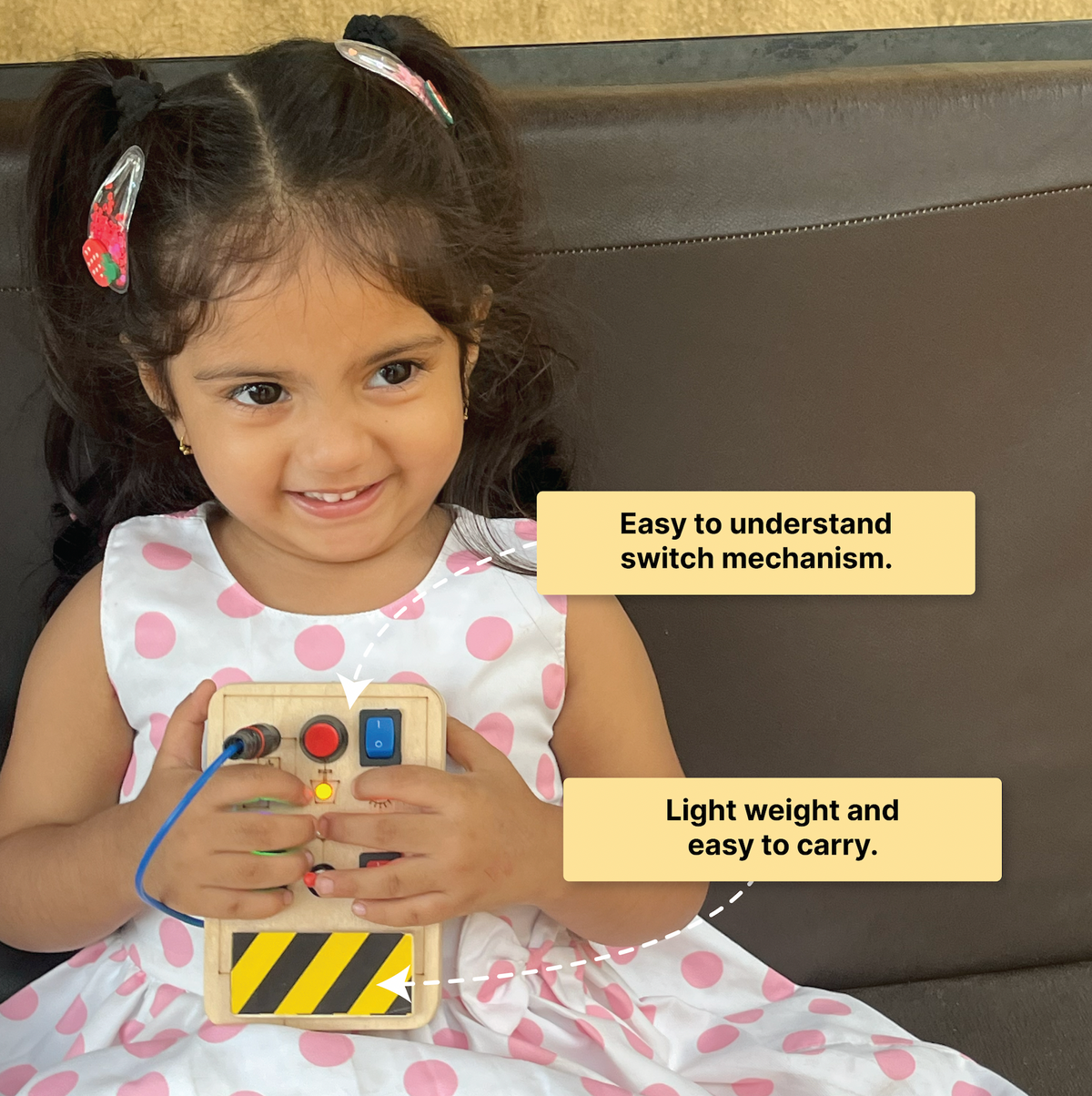 Toddler interacting with the Montessori Portable Switches Wooden Busy Board V1,  skill-building wooden toys.
